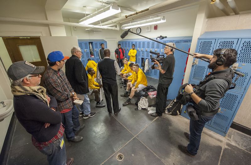 Filmmakers Ben and Orson Cummings, left and second to left, oversee filming of the Bridgehampton boys basketball team on Tuesday. Michael Heller